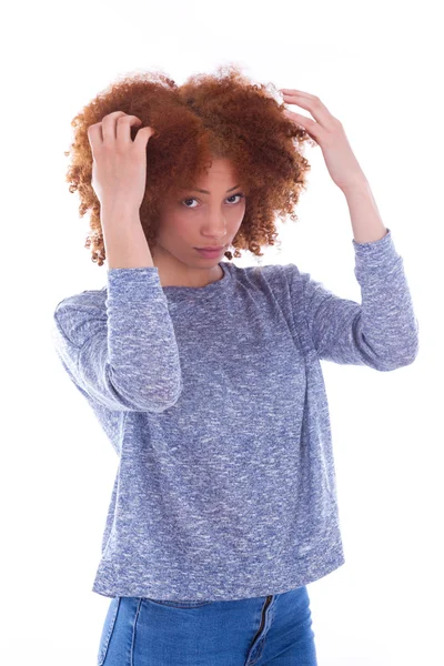 Teenage girl holding her curly tangled hair — Stock Photo, Image