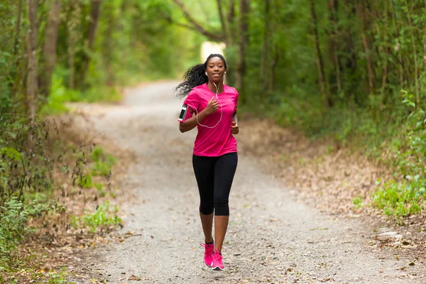 African american woman runner jogging outdoors - Fitness, peopl — Stock Photo, Image