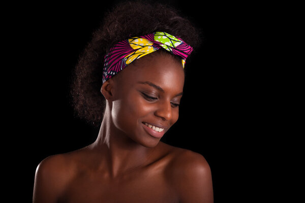 Young beautiful african woman portrait, Isolated over black background