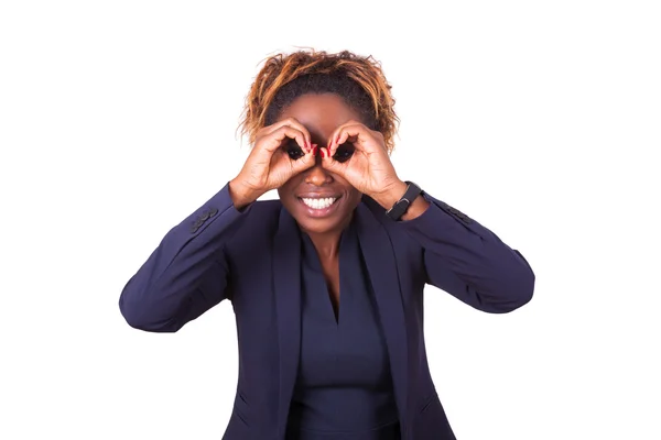 Afro-americano mulher de negócios fazendo binocular gesto com ele — Fotografia de Stock