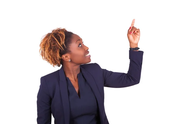 Africano americano mulher de negócios apontando algo para cima - Preto pe — Fotografia de Stock