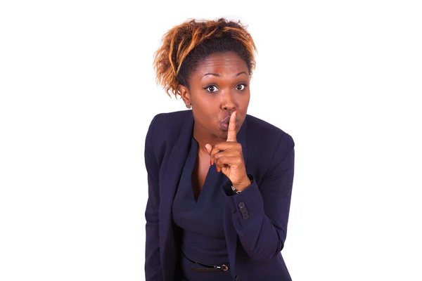 African American business woman making silence gesture with her — Stock Photo, Image