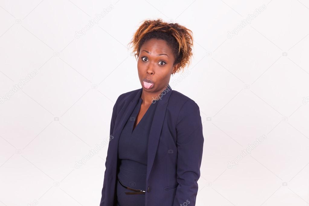 African American business woman sticking tongue out