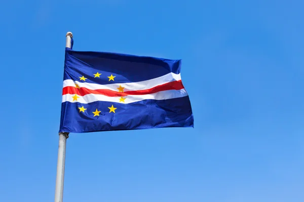 Cape verde flag waving on wind over a blue sky — Stock Photo, Image