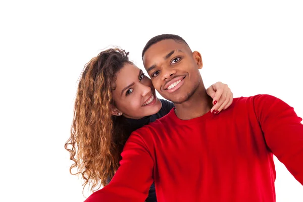 Happy mixed race couple taking a selfie photo over a white backg — Stock Photo, Image