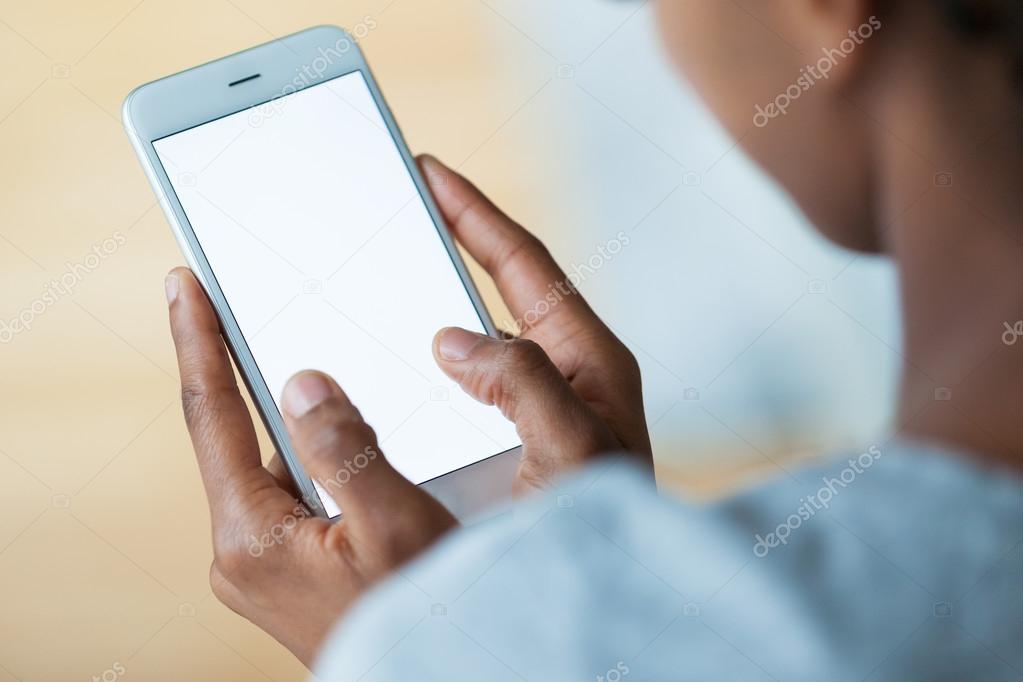 African american person holding a tactile mobile smartphone - Bl