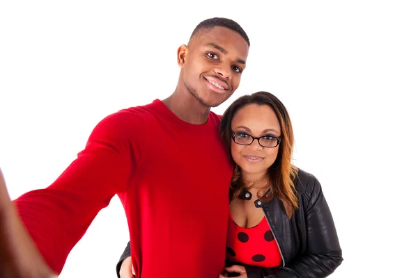 Happy mixed race couple hugging over a white background — Stock Photo, Image