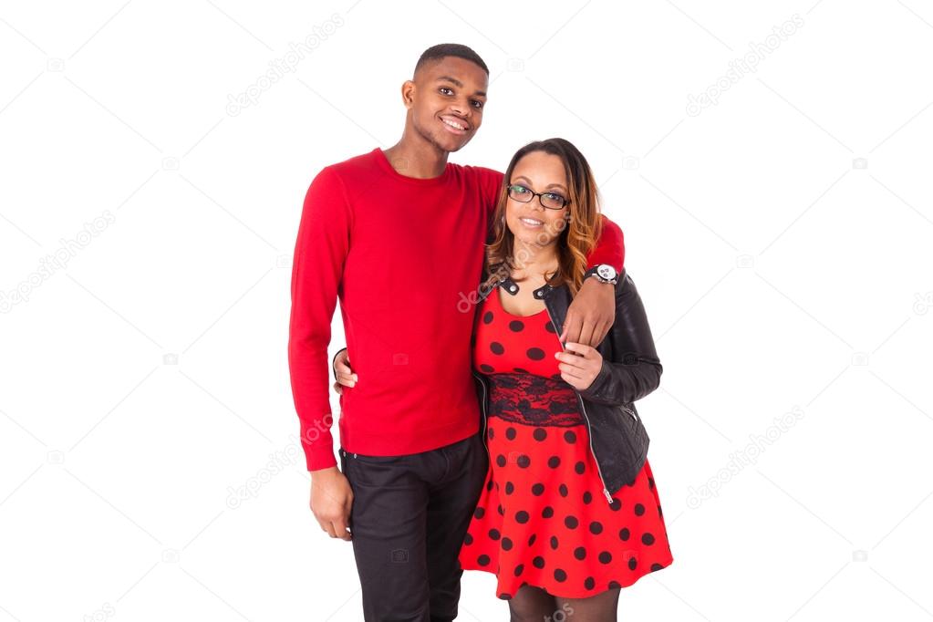 Happy mixed race couple hugging over a white background