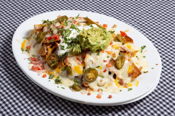 Plate Delicious Tortilla Nachos Melted Cheese Sauce Ground Beef Jalapeno — Stock Photo, Image