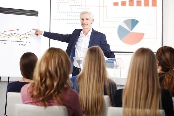 Senior businessman giving a presentation — Stock Photo, Image