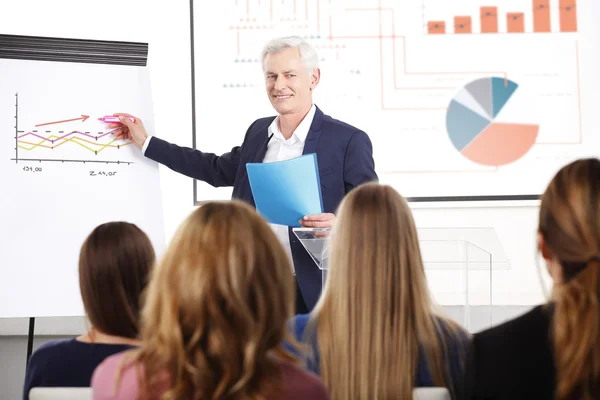 Senior businessman giving a presentation — Stock Photo, Image