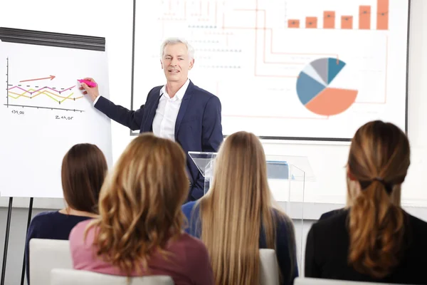 Senior businessman giving a presentation — Stock Photo, Image