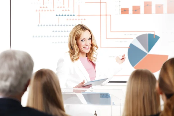 Businesswoman giving presentation at business conference — Stock Photo, Image