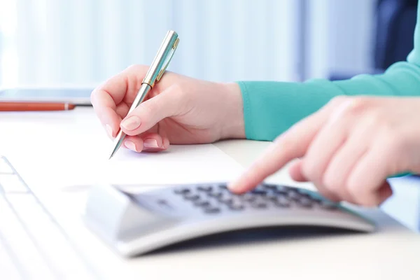 Businesswoman working on financial plan Stock Photo