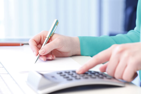 Businesswoman working on financial plan 