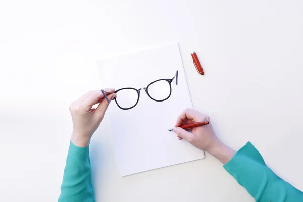 Hand writing on white blank paper — Stock Photo, Image