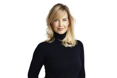 Studio portrait of attractive blond haired woman wearing turtleneck sweater while standing at isolated white background.  clipart