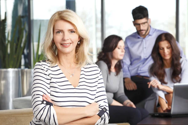 Active business woman with colleagues — Stock Photo, Image