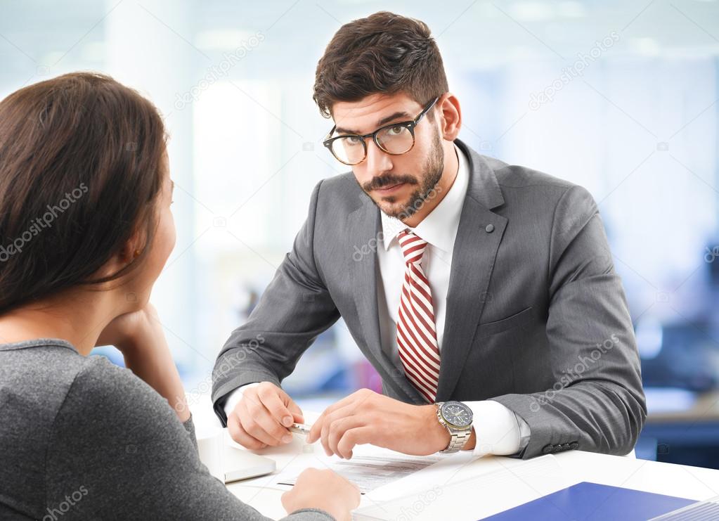 businessman interviewing young woman
