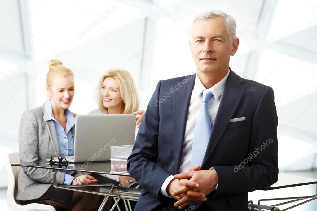 Businessman with women on background