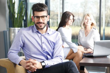 Young broker with Financial experts