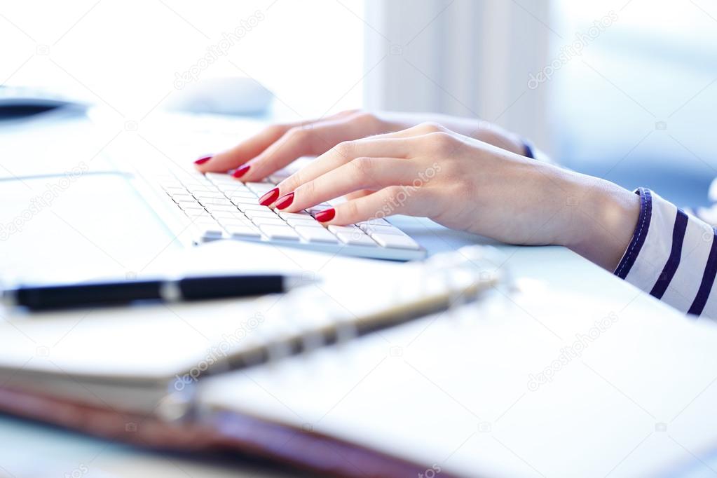 hands Typing on keyboard