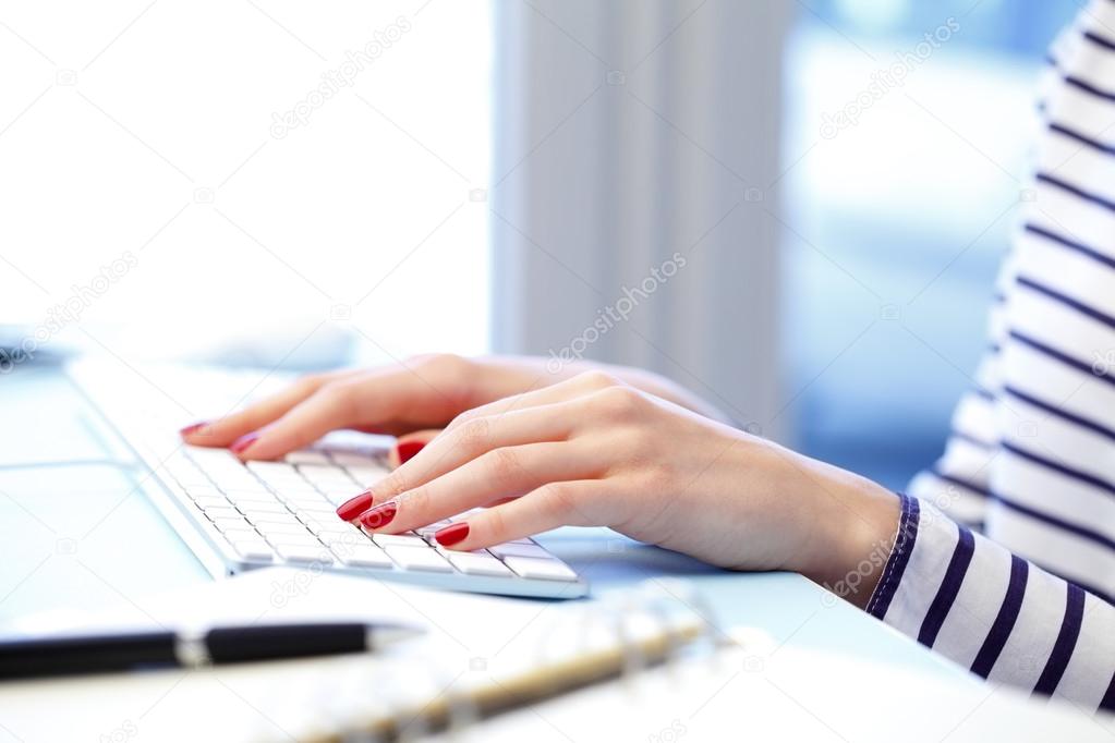 hands Typing on keyboard
