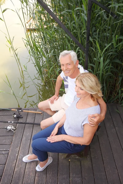 Happy senior couple fishing — Stock Photo, Image