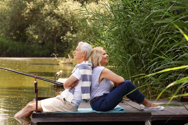 Happy senior couple fishing — Stock Photo, Image