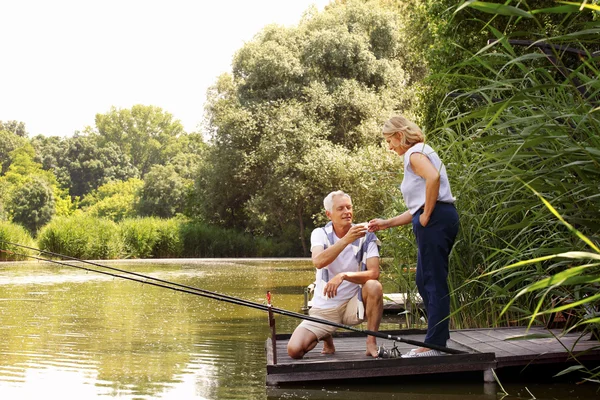 Senior couple relaxing and fishing — Stok fotoğraf