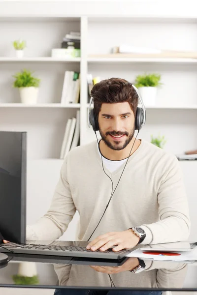 Young businessman with headphone