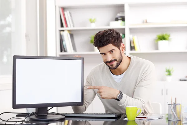 Businessman points to the white screen — Zdjęcie stockowe