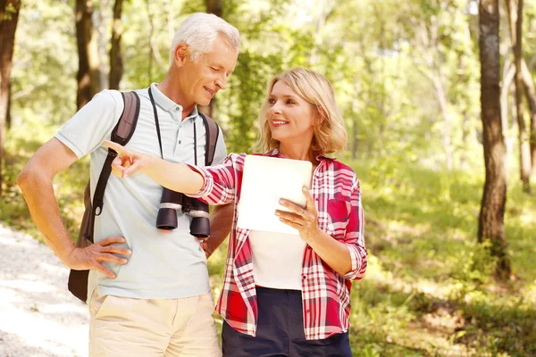 Hiking senior couple take an excursion. — Stok fotoğraf