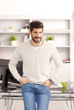 Businessman looking at camera while smiling.