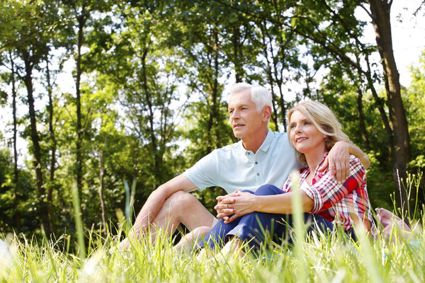 Relaxing senior couple in the nature