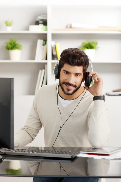 Happy businessman with headphone