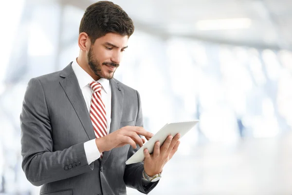 Young broker holding digital tablet — Stock Photo, Image
