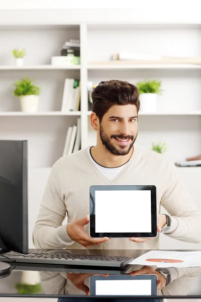 Young professional with tablet — Stok fotoğraf