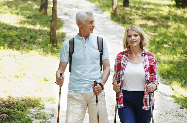 Active senior couple enjoying a nordic walk