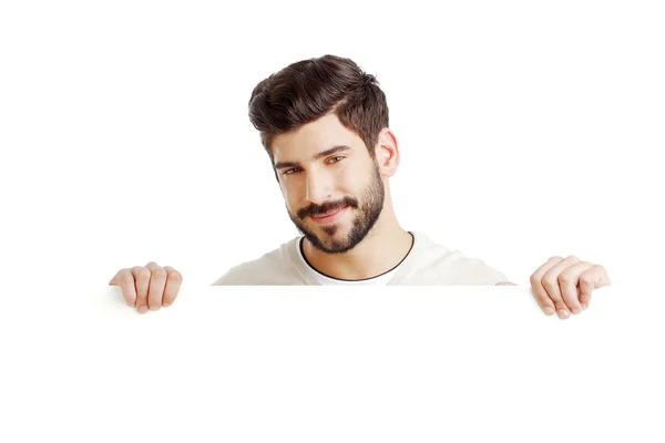 Young businessman with blank signboard — Stock Fotó