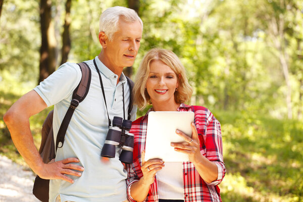 Senior couple strolling through the forest