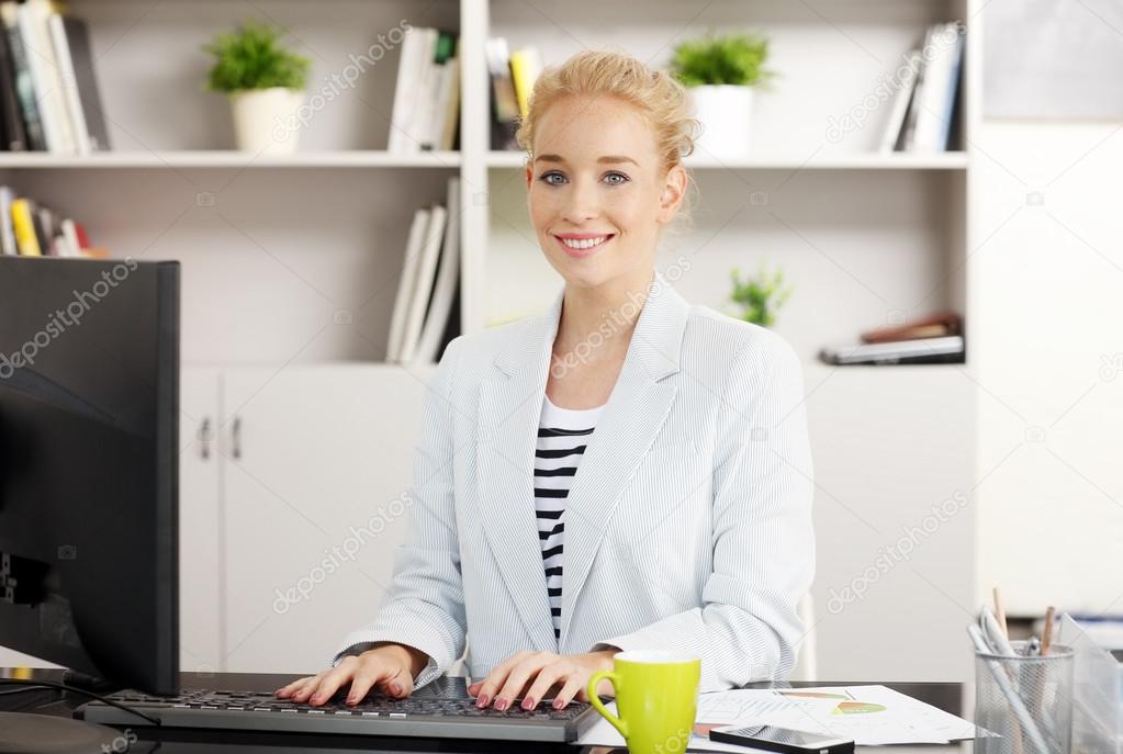 Young businesswoman working at office