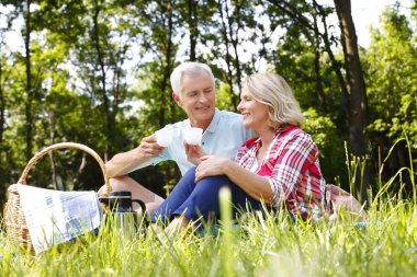 Senior couple chilling out in forest