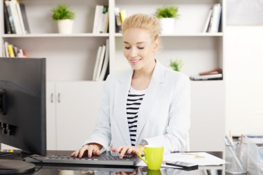 Young businesswoman working on her presentation