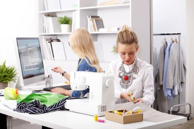 Creative fashion designers working together