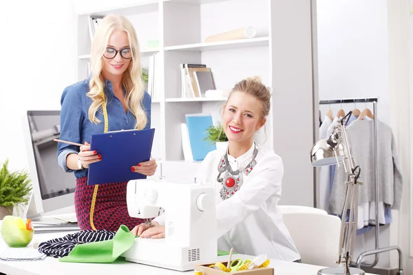 Businesswomen working together in designer studio — Stock Fotó