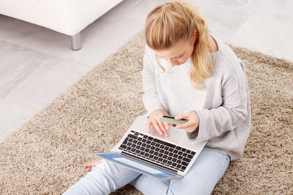 Young woman shopping online on laptop
