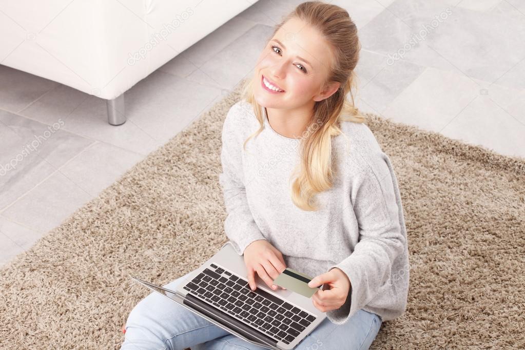 Young woman shopping online on laptop