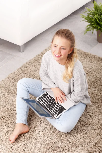 Young student with laptop — Stock Photo, Image