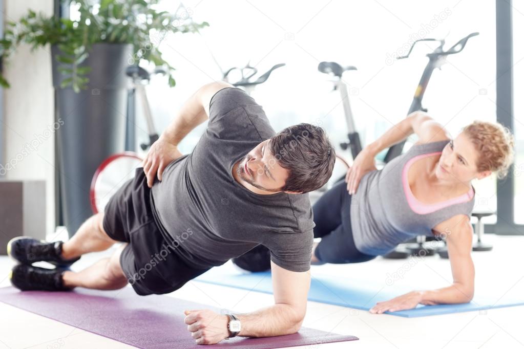 Couple  exercising in a fitness center.